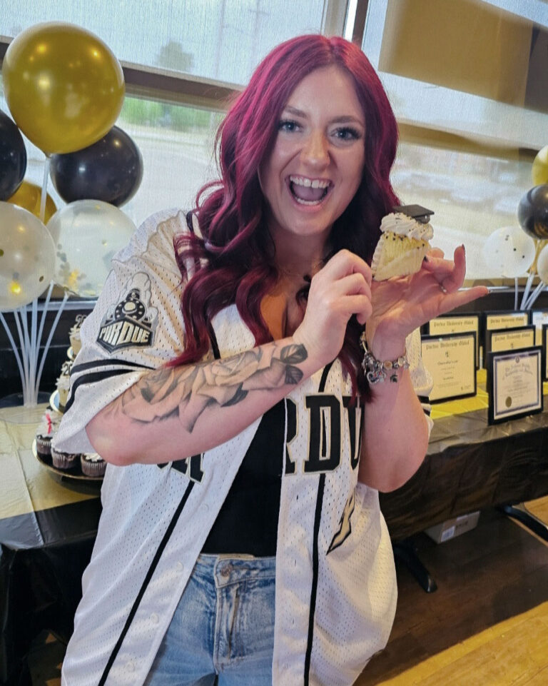 Excited at the Black and Gold reception — a favorite tradition of Purdue Global grads when students and their families gather the night before commencement ceremonies for food, photo ops and socializing. (Photo provided)
