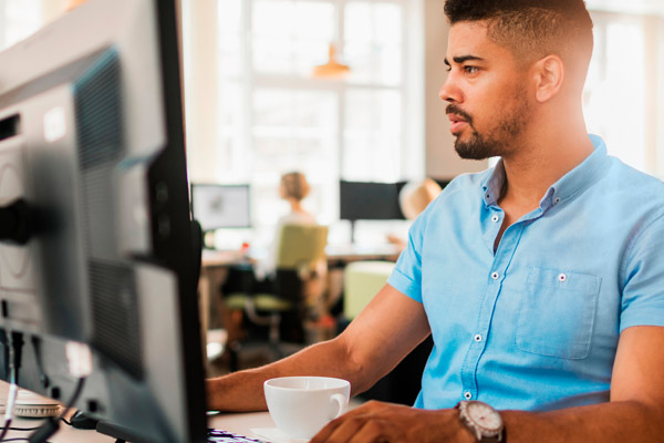 A man looks at a computer
