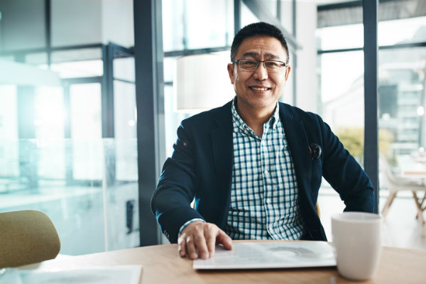 Man sitting behind desk