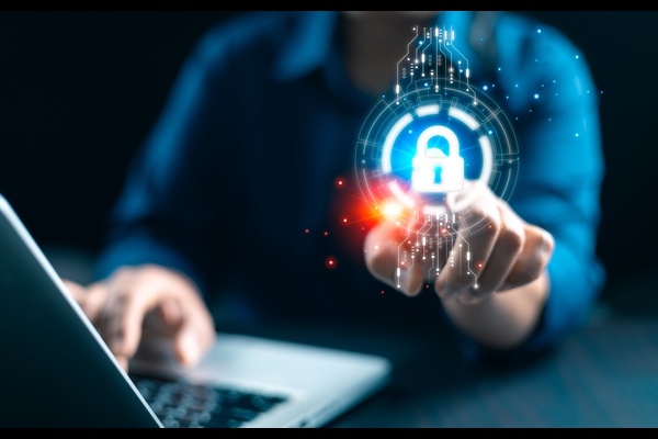 A digital security lock icon hovering over a person's fingertip.