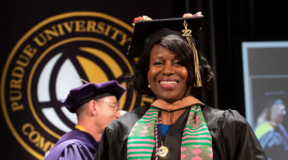 Sheila Taylor in cap and gown at a Purdue Global graduation ceremony
