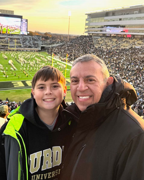He is proud to set an example for his son, Xavier. They enjoy cheering on the Boilermakers in Ross-Ade Stadium. (Photo provided)