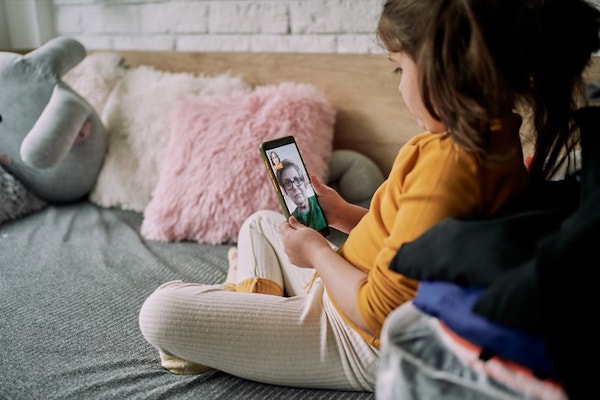 A child receives teletherapy
