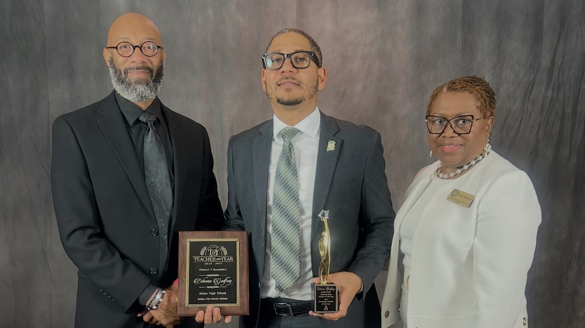 Cap: Eshwaa Godfrey, center, receives the Alabama Alternate Teacher of the Year award from David Scott, Selma City Schools superintendent, and Tonya Chestnut, District 5 Alabama State Board of Education member. (Photo provided)
Alt: Eshwaa Godfrey holding an award.
