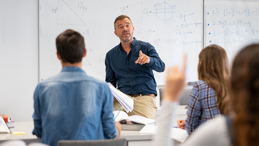 Student raising a hand with a question for the teacher.
