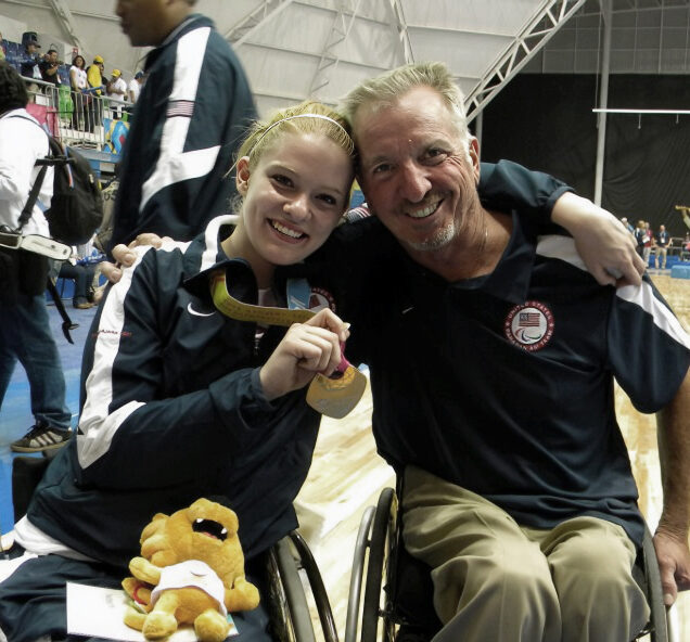 Hollermann poses with an early coach of hers, David Kiley, after a win. Hollermann says she has accomplished all that she has because of the many volunteers who devote their time to her sport. (Photo provided)