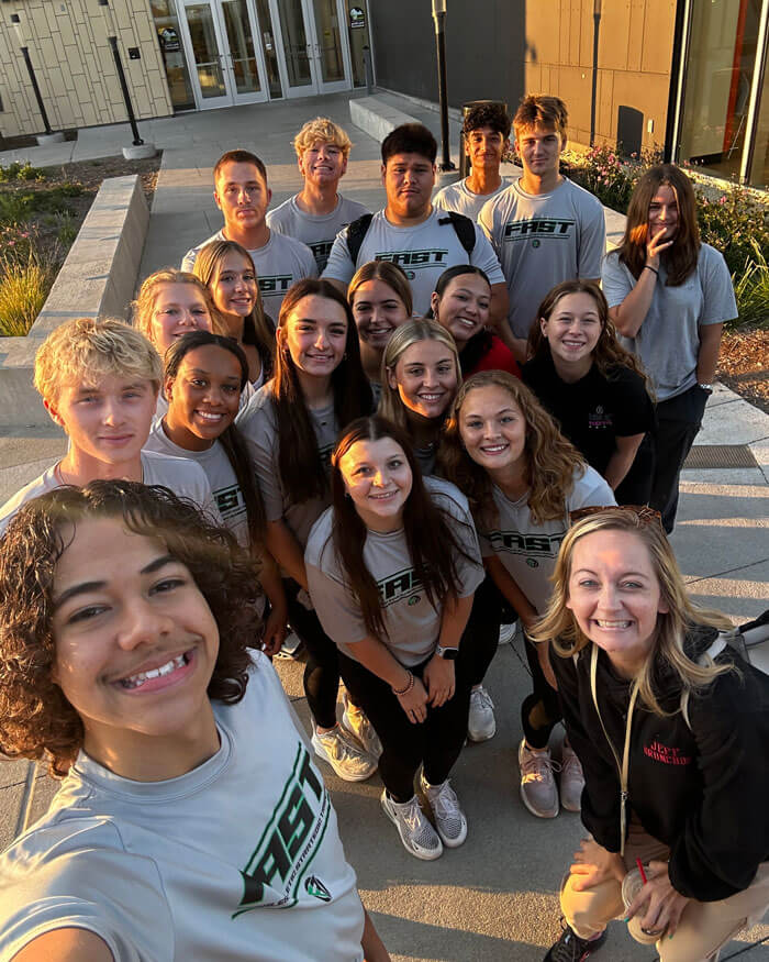 Newhart poses for a selfie with the students of her class. 