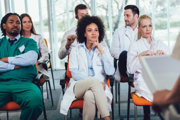 A nurse attends a presentation about entrepreneurship opportunities.