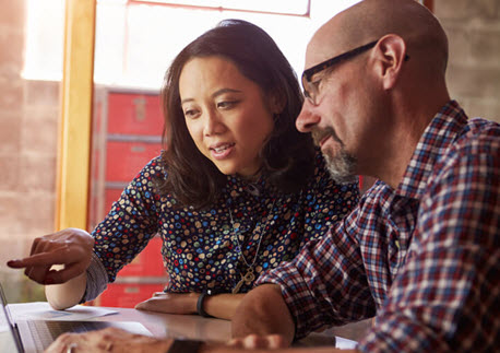 man and woman working together