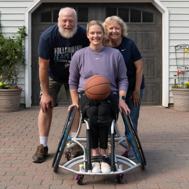 Rose Hollermann with her parents, John and Michele, at their home in Minnesota. (Purdue University photo/John Underwood)