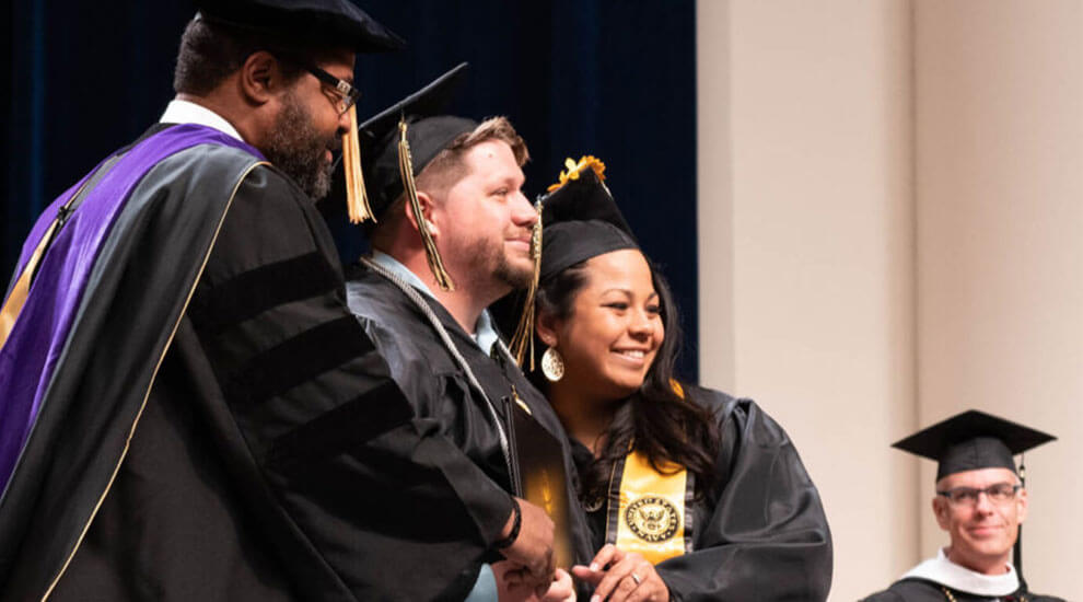James Scott and Tracy Ly Scott at a Purdue Global graduation ceremony