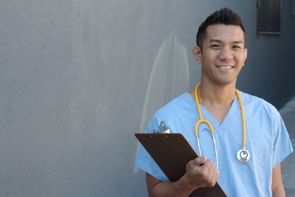 A travel nurse wearing scrubs