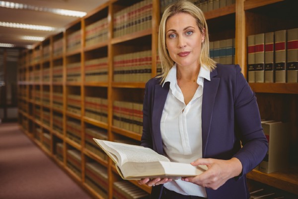 A law student studies a law book in preparation for the examination.