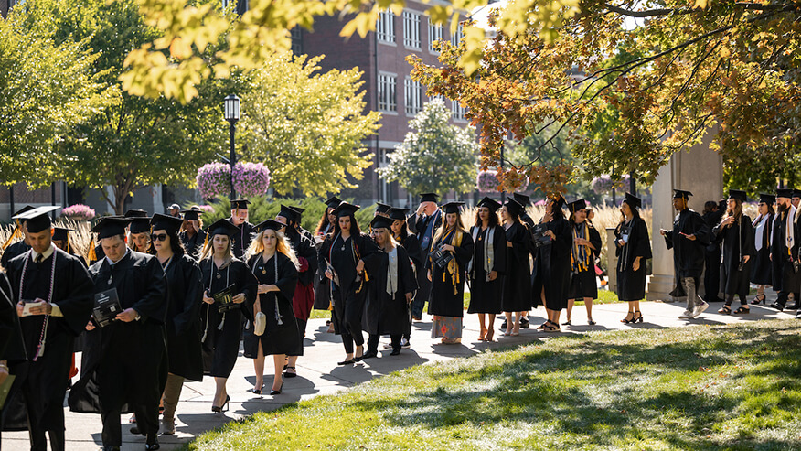 Purdue Global graduates walk across Purdue University’s campus during commencement Oct. 11. (Purdue Global photo/Kelsey Lefever)