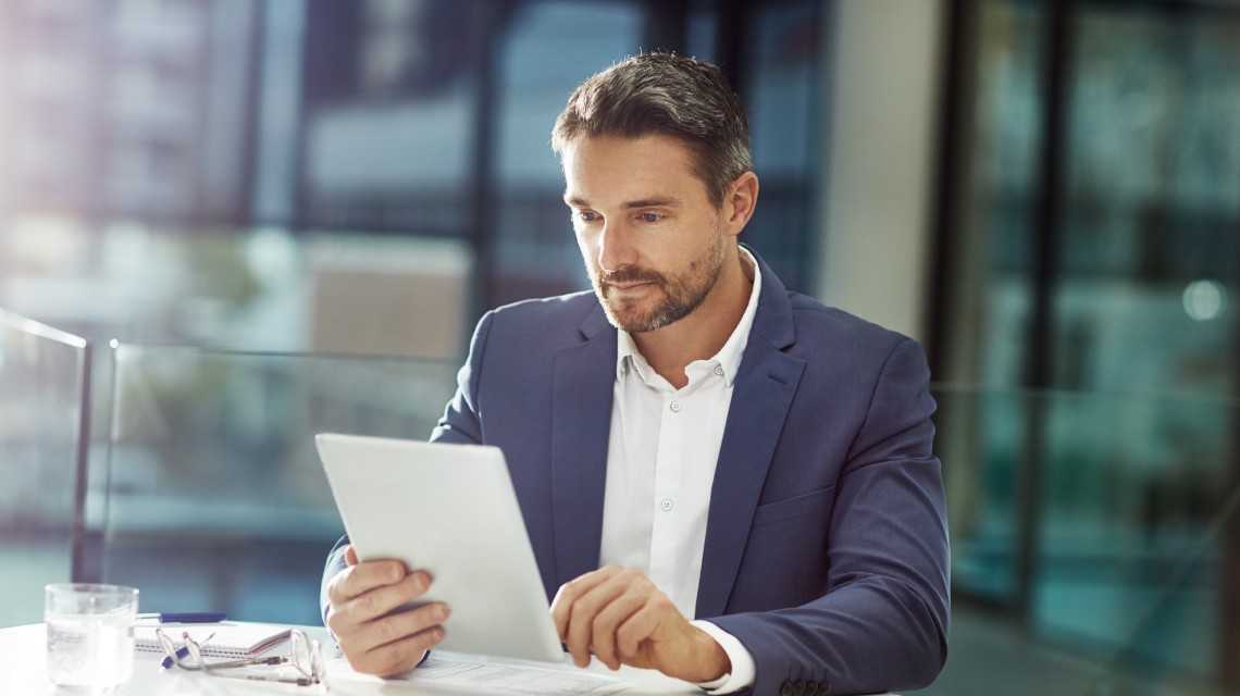 A man reviewing his messages.
