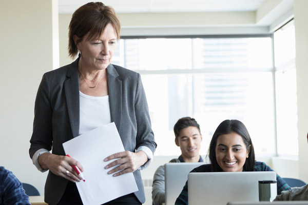 A woman holds a piece of paper