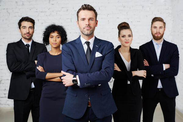 Early career professionals posing confidently