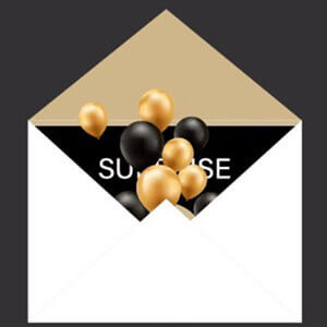 open envelope with a card stating Surprise and black and gold balloons spilling out