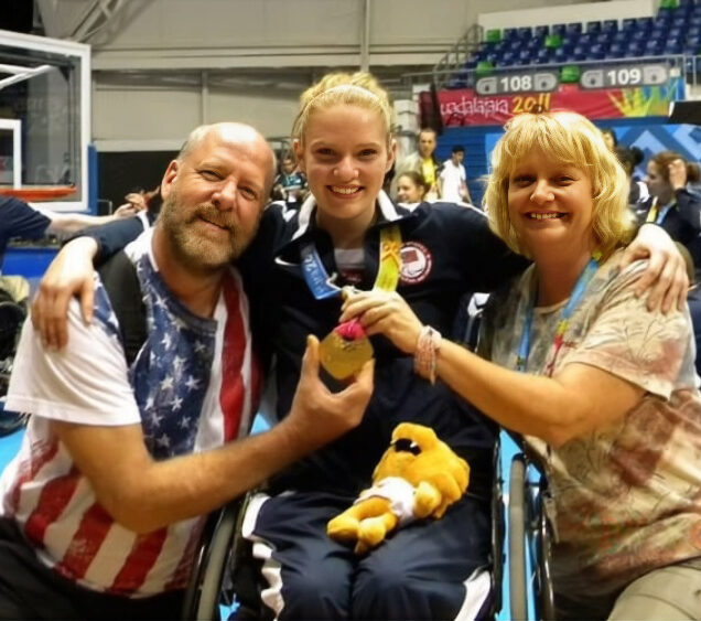 Hollermann celebrates a win with her parents, who, she says, have always been the loudest parents in the gym. (Photo provided)
