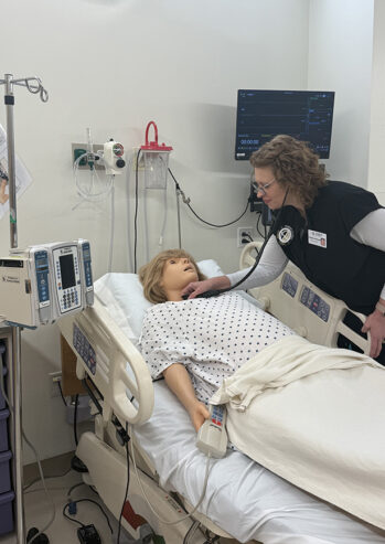 Purdue Global student Christina McLeod participates in a patient simulation in Purdue Global’s simulation center at Northern Light Eastern Maine Medical Center.