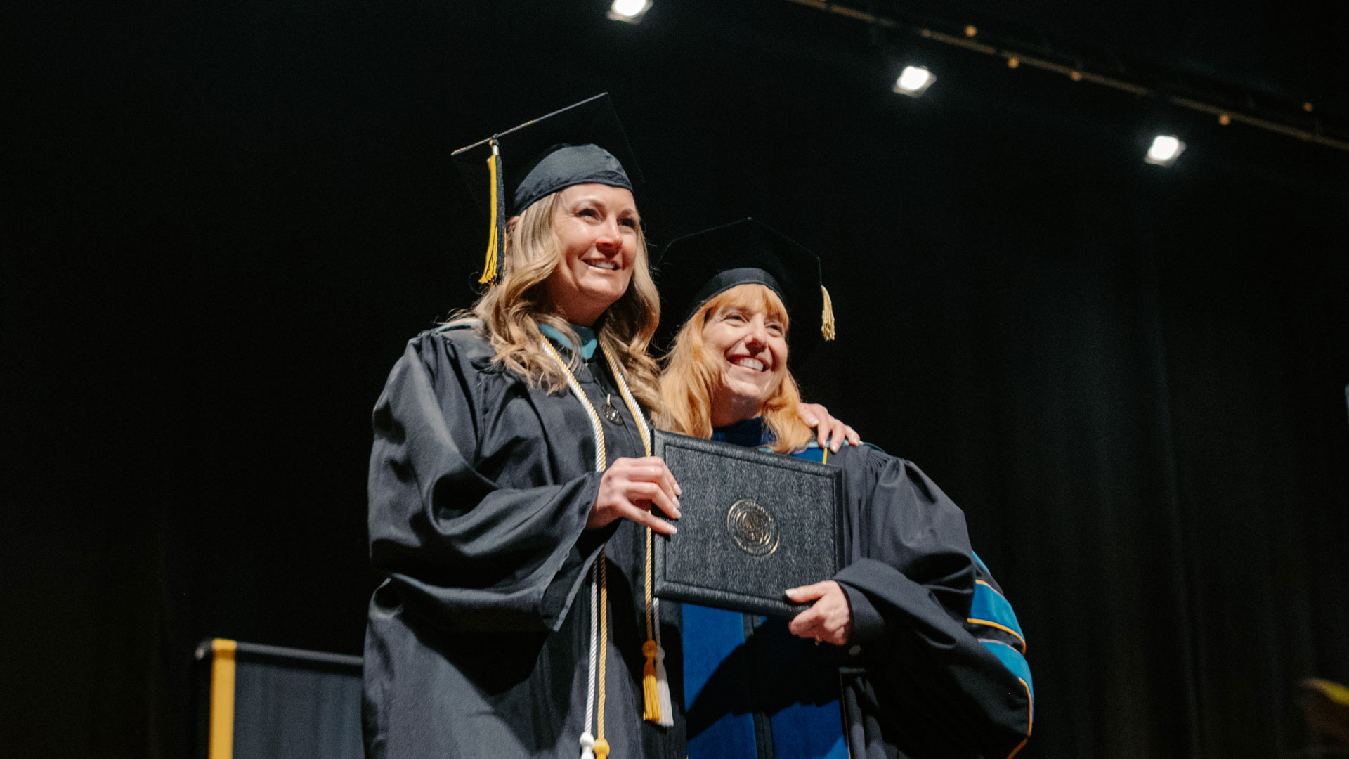Patti accepting her diploma at graduation