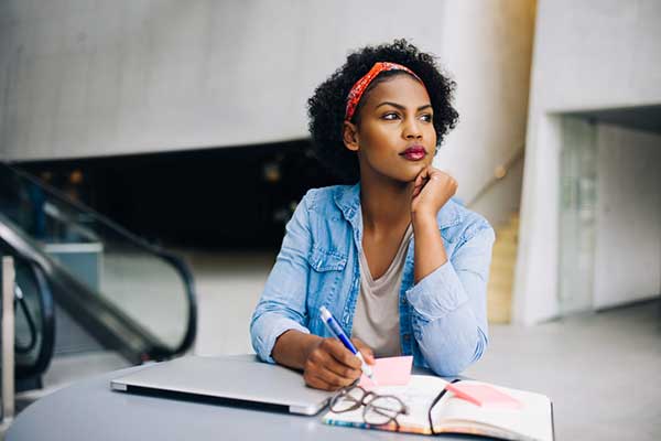 A woman sits at a desk