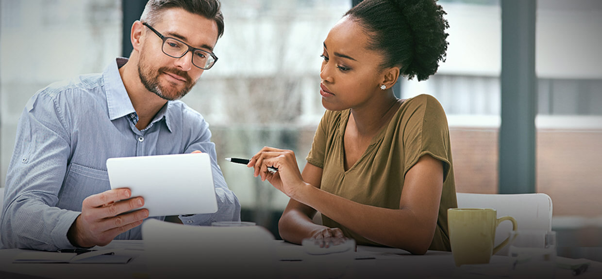 Two co-workers discussing a paper