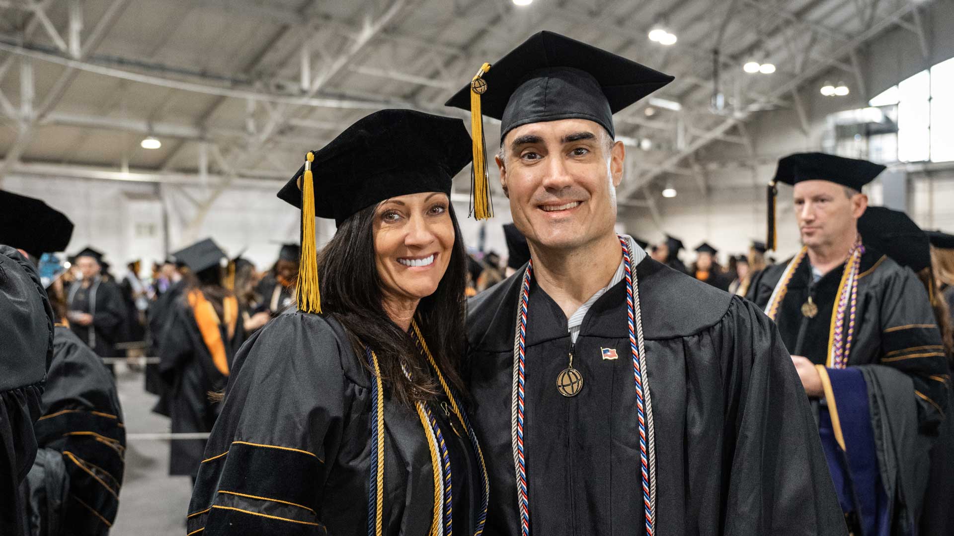The Favrettos celebrate their graduation together during an October ceremony at Purdue University’s West Lafayette location. (Purdue Global photo/Kelsey Lefever)