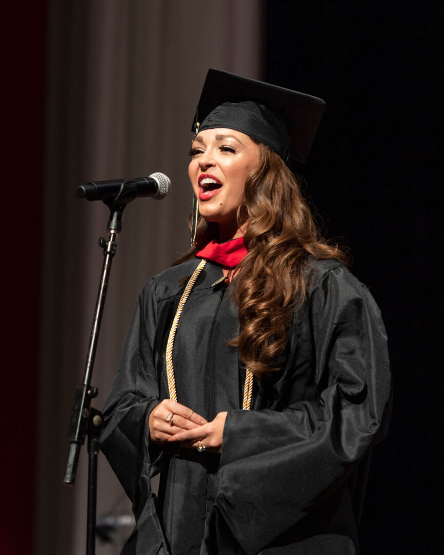 From training in classical opera to covering the Eagles, Holman has a range of experiences that prepared her for performing the national anthem at Purdue Global’s Fall 2022 commencement. (Purdue University photo/John Underwood)