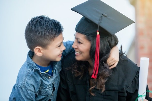Woman celebrating graduation with child