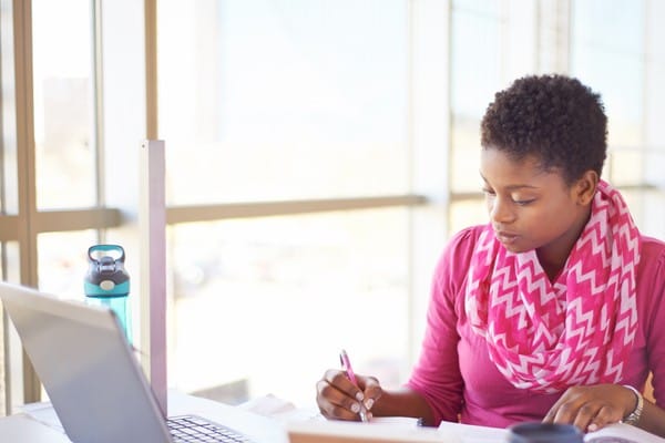 A female law student taking an exam online.