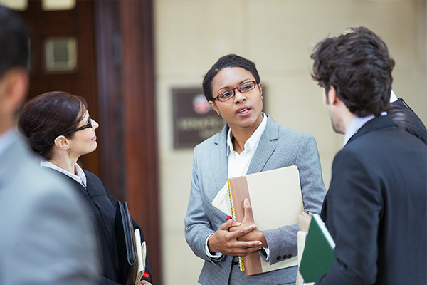 A judge meets with lawyers to discuss a case.