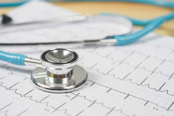 A stethoscope on a desk