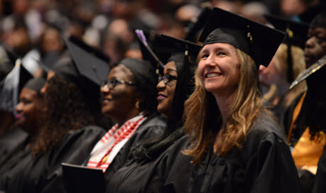 group of students in caps and gowns at Purdue Global graduation ceremony
