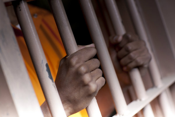 A man behind bars because he can't afford to pay a cash bail.