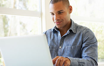 Man applying for Admissions at Purdue Global