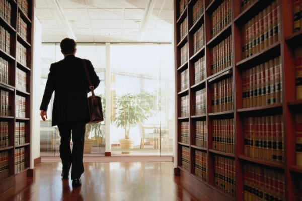A man walks through a law library.