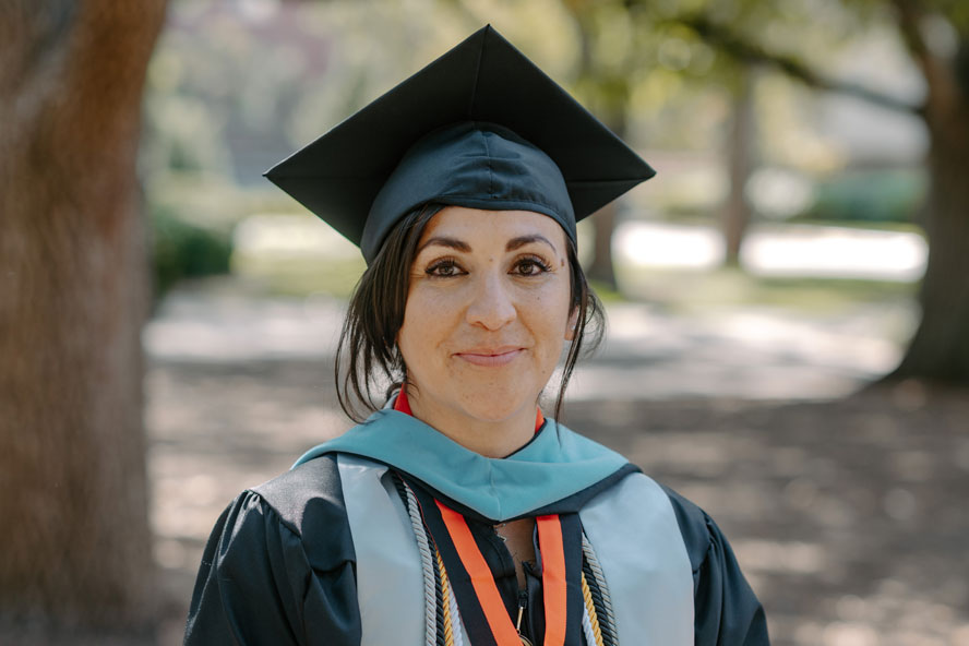 Purdue Global alumna Yvette Martinez in cap and gown
