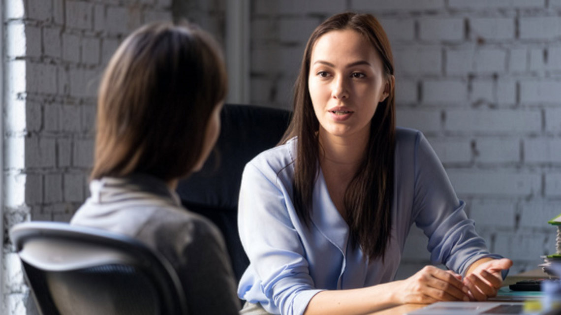 Two women discussing the benefits of a dual degree.