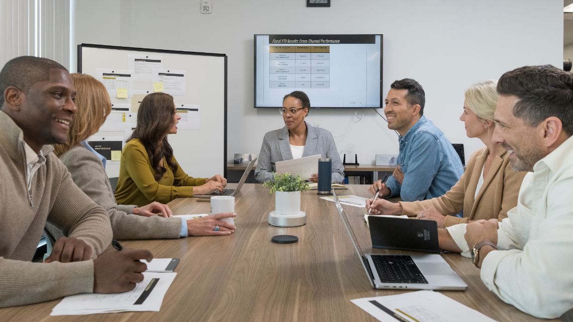 A collaborative group of work colleagues going over a project.