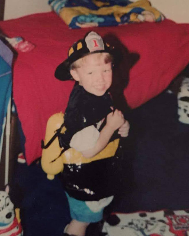 Three-year-old Dillon Dunn poses for a photo wearing a firefighter costume.
