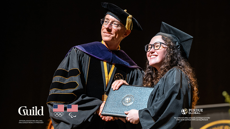 Lauryn DeLuca receives her degree during a graduation ceremony.