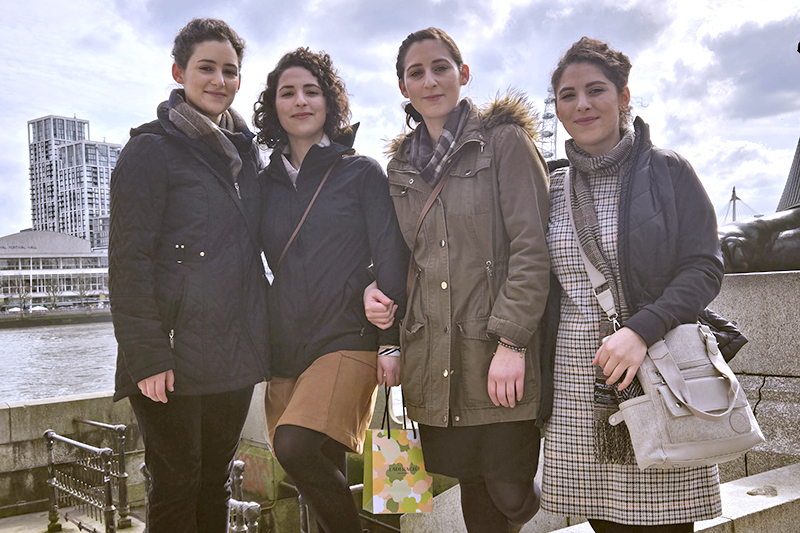 Minaise sisters standing in front of the River Thames