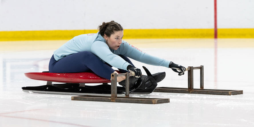 Ashley Farquharson practices the “pull,” a crucial start technique that demands explosive strength and precision as she powers her sled into motion. (Purdue Global photo/John Underwood)