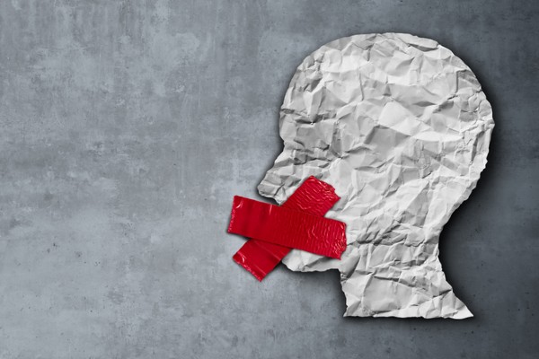 drawing of a person's head with red tape over their mouth