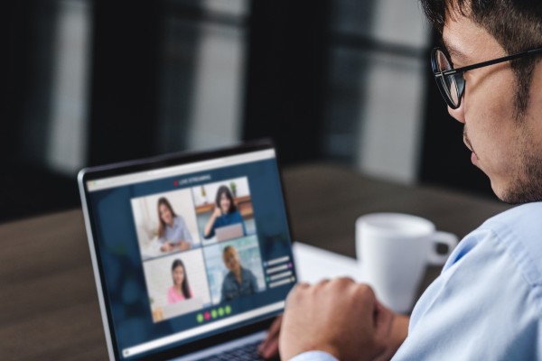 A person attends a virtual career fair on a laptop