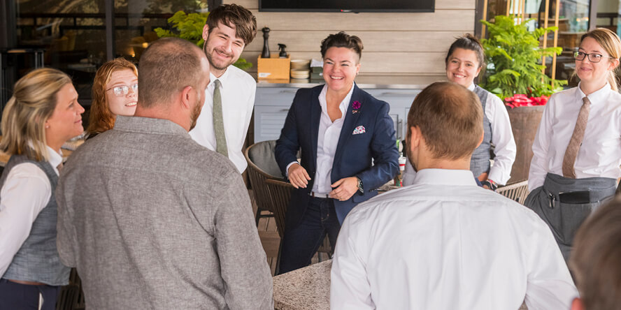 Leanna Chroman, Huse Culinary’s vice president of learning and culture, meets with staff members at the HC Tavern + Kitchen in Fishers, Indiana. (Purdue University photo/John Underwood)