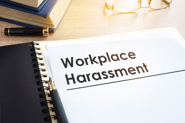 A legal document with the words "Work Harassment" written across the page.