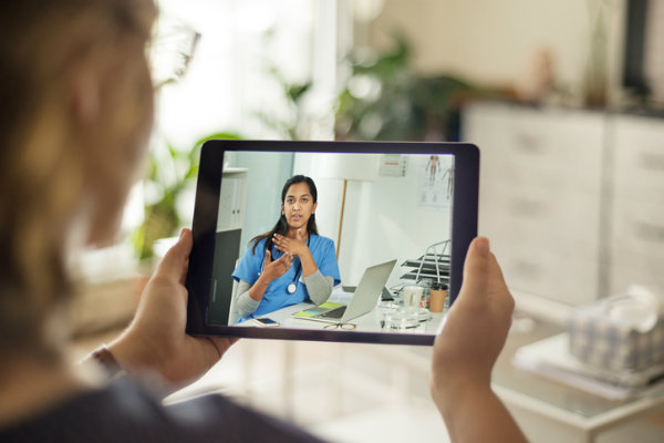 A telehealth nurse consults with a patient