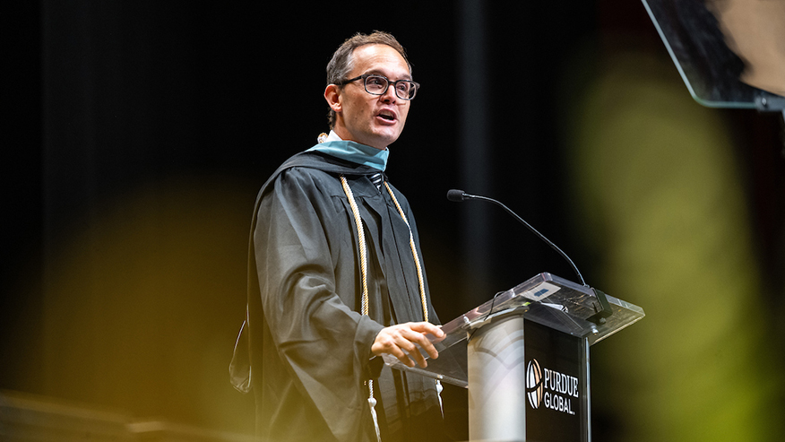 Purdue Global alum and commencement speaker Pat Doney of Dallas encourages graduates during Purdue Global’s October commencement ceremonies. (Purdue Global photo/Kelsey Lefever)